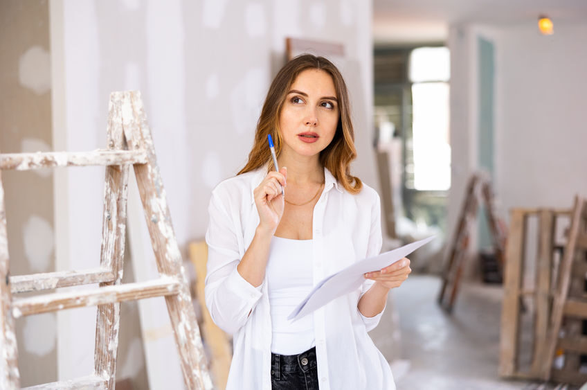 Woman construction manager checking project documentation
